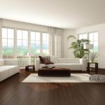 Spacious Living Room With White Sofa And Wood Floor - Laminate Flooring Nz - Woodland Lifestyle