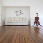 White Sofa On A Wood Flooring - Laminate Flooring Solutions - Woodland Lifestyle